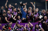 Bristol Bears chairman Chris Booy hoists the Challenge Cup trophy