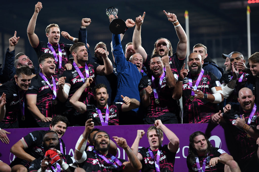 Bristol Bears chairman Chris Booy hoists the Challenge Cup trophy